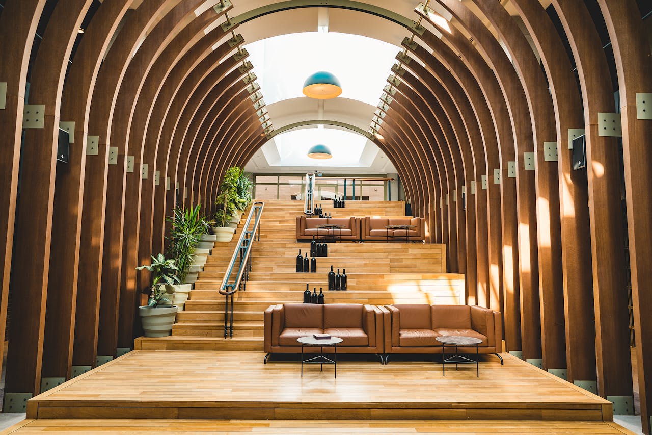 Discover a modern hotel lounge with stylish interior design in Çanakkale, Turkey. Perfect blend of wood and natural light.